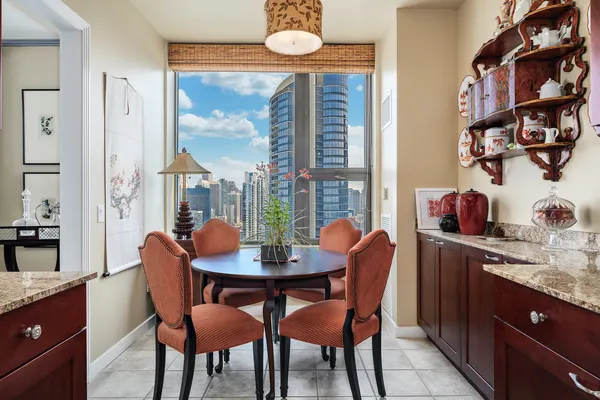 a dining room with furniture and window