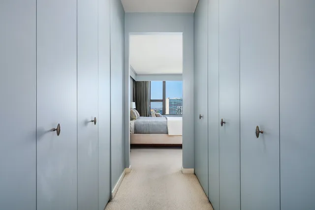 a view of a bedroom from a hallway