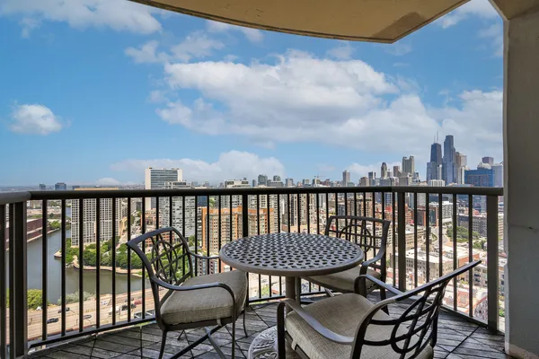 a view of a balcony with chairs