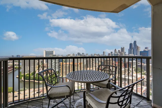 a view of a balcony with chairs