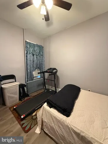 a bedroom with bed and window