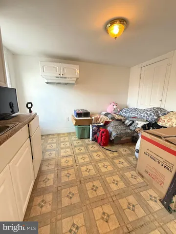 a bed room with a bed and a window