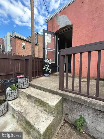 a view of a dinning table and chair in the patio