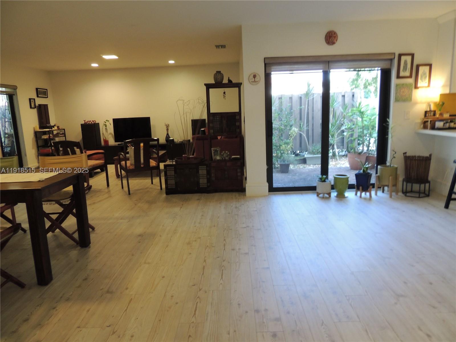 7951 Eastlake Drive, Unit C Boca Raton, FL 33433 - Photo 21 of 46 a living room with furniture and a flat screen tv