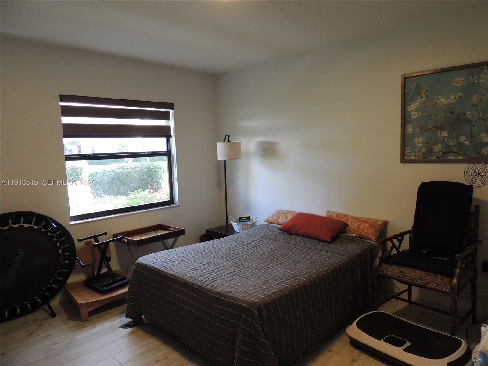 7951 Eastlake Drive, Unit C Boca Raton, FL 33433 - Photo 30 of 46 a bedroom with a bed and a window