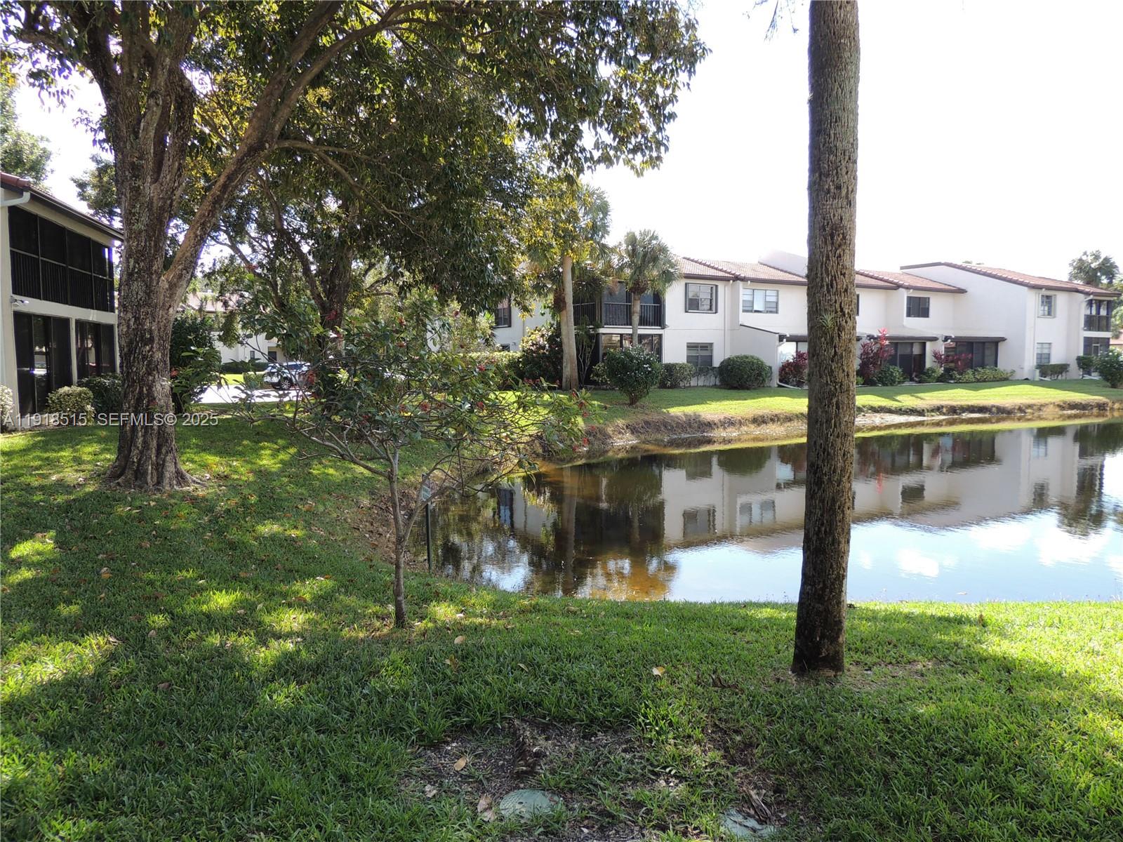 7951 Eastlake Drive, Unit C Boca Raton, FL 33433 - Photo 35 of 46 a view of a building with a yard