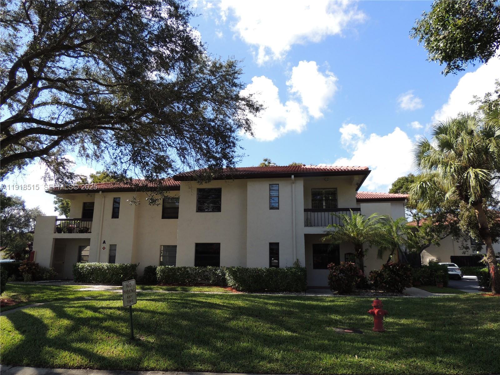 7951 Eastlake Drive, Unit C Boca Raton, FL 33433 - Photo 41 of 46 a front view of a house with a yard