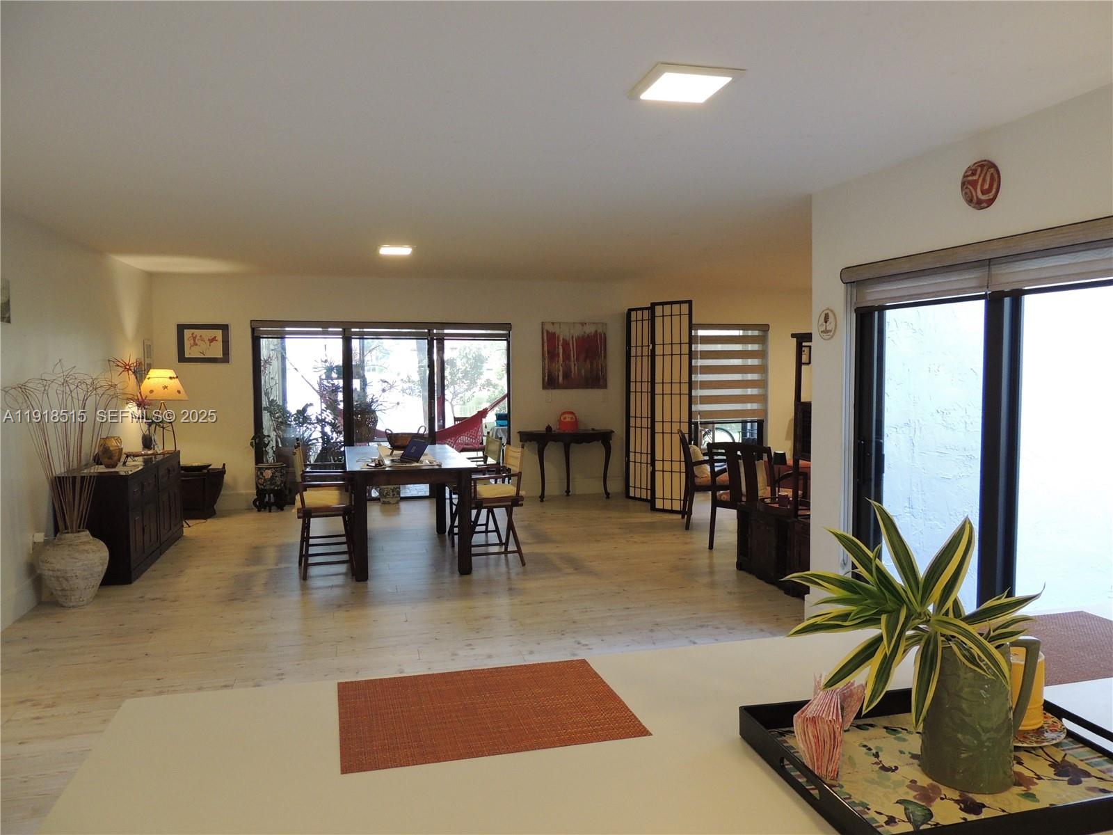7951 Eastlake Drive, Unit C Boca Raton, FL 33433 - Photo 6 of 46 a living room with furniture and potted plants