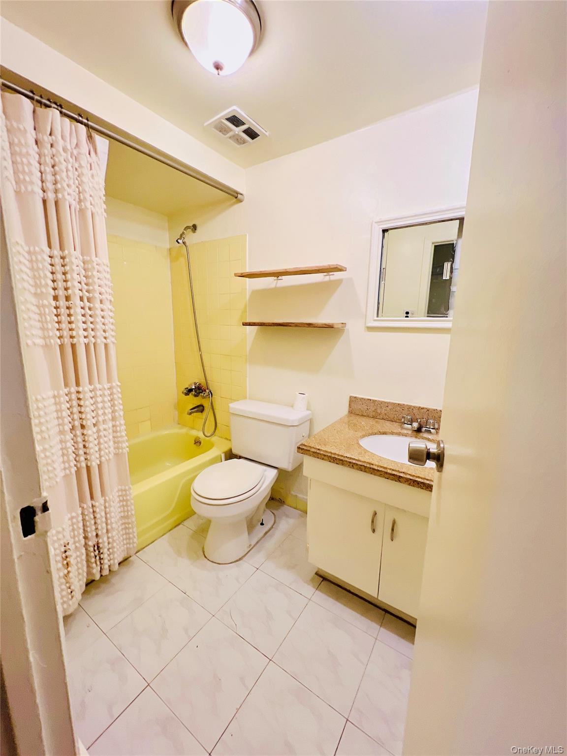 13-27 Bell Boulevard, Unit 3F Queens, NY 11360 - Photo 9 of 11 a bathroom with a sink toilet and shower