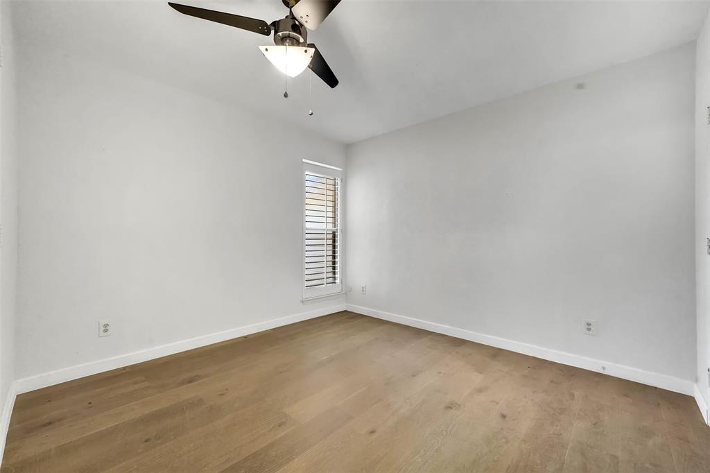 2111 East Belt Line Road, Unit 166B Richardson, TX 75081 - Photo 15 of 23 Empty room with light wood finished floors and ceiling fan