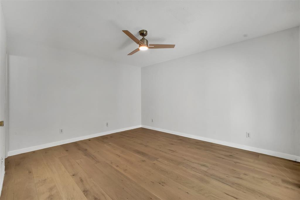 2111 East Belt Line Road, Unit 166B Richardson, TX 75081 - Photo 17 of 23 Empty room featuring wood-type flooring and a ceiling fan