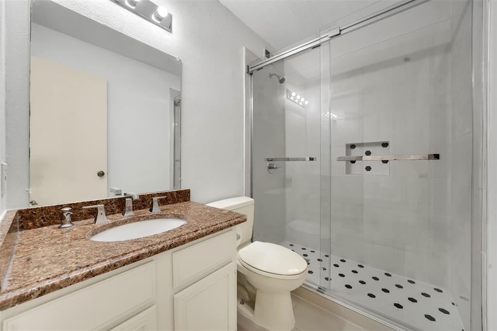 2111 East Belt Line Road, Unit 166B Richardson, TX 75081 - Photo 19 of 23 Full bathroom featuring vanity and a shower stall