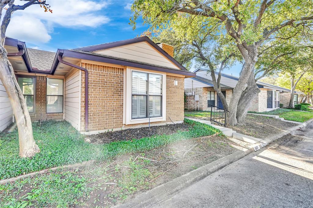 2111 East Belt Line Road, Unit 166B Richardson, TX 75081 - Photo 2 of 23 View of side of property featuring brick siding and a chimney