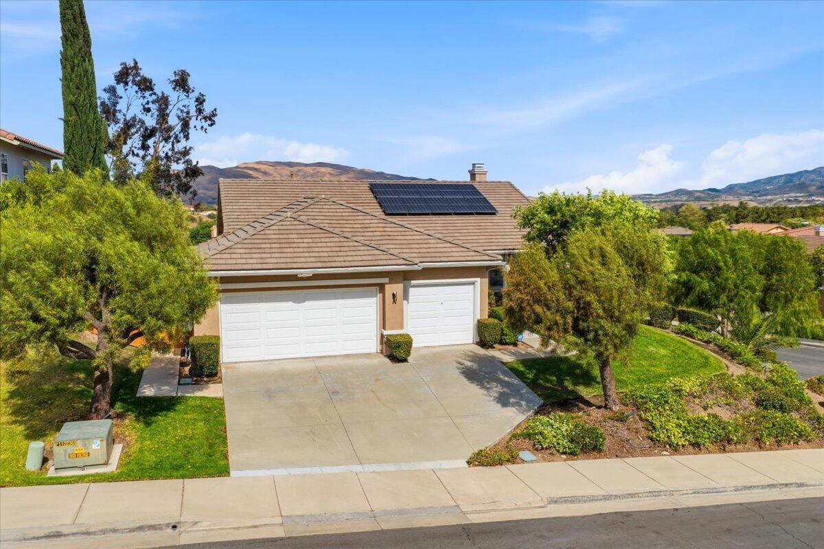 23732 Bella Vista Road Corona, CA 92883 - Photo 37 of 49 front view of a house with a yard