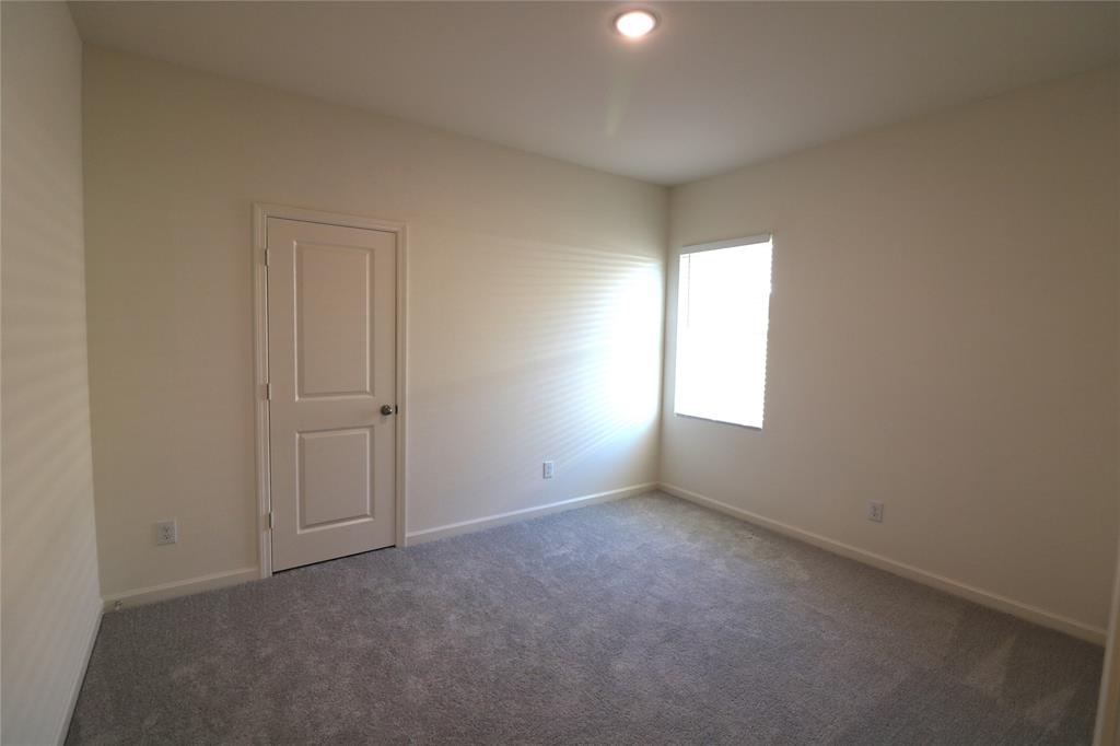 1301 Elliott Road Howe, TX 75459 - Photo 20 of 27 Recessed ceiling light, neutral wall paint, gray carpeting, white window blinds, and a paneled interior door