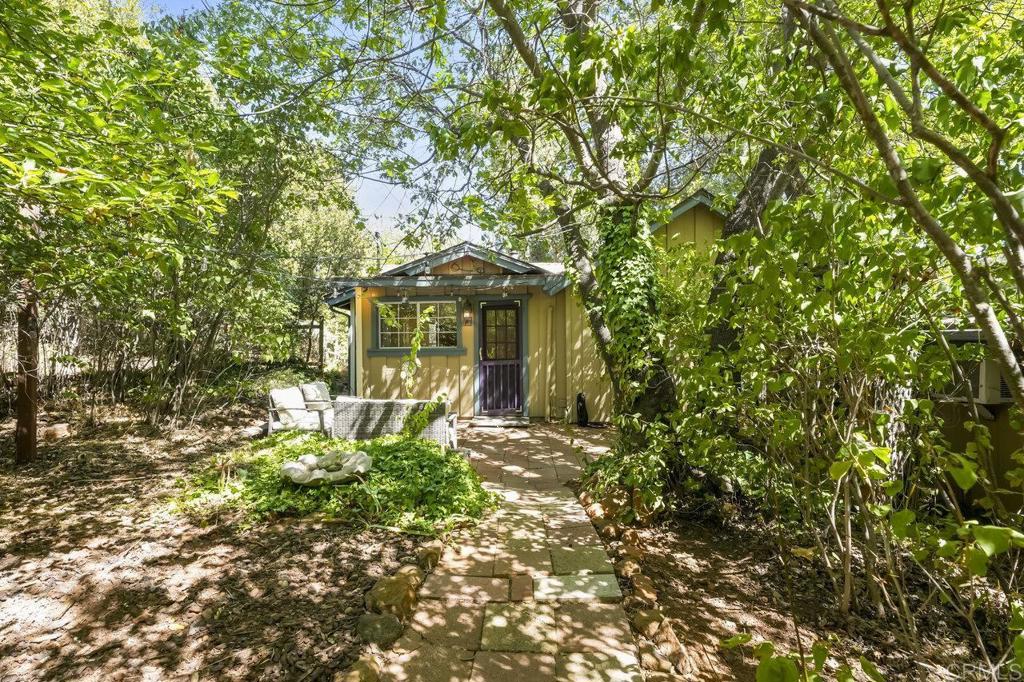 3055 Pera Alta Drive Julian, CA 92036 - Photo 14 of 44 a front view of a house with a garden