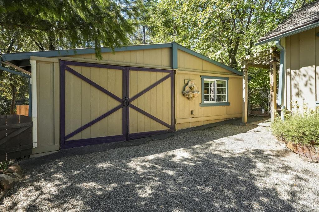 3055 Pera Alta Drive Julian, CA 92036 - Photo 29 of 44 a backyard of a house with table and chairs