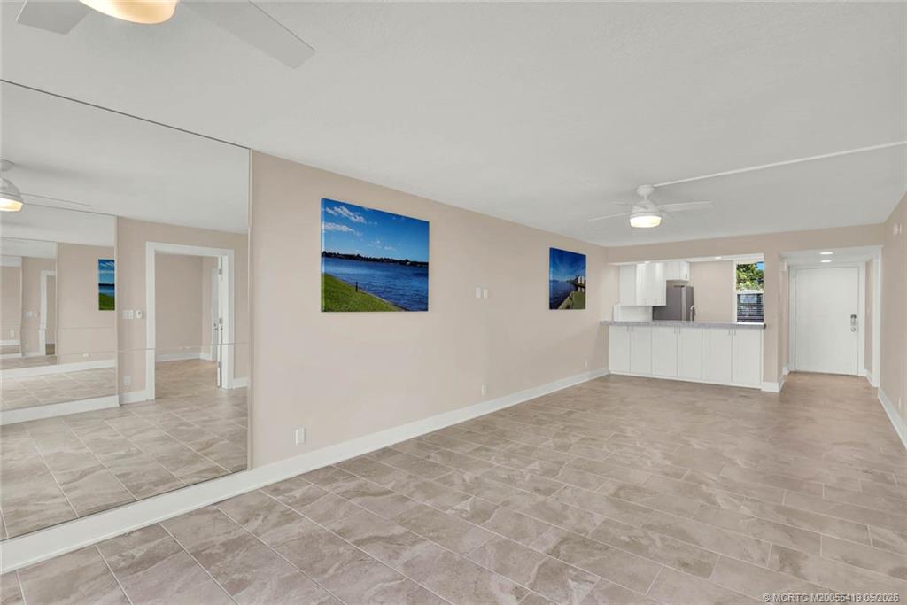 1950 Southwest Palm City Road, Unit 14305 Stuart, FL 34994 - Photo 17 of 70 an empty room with entrance and windows