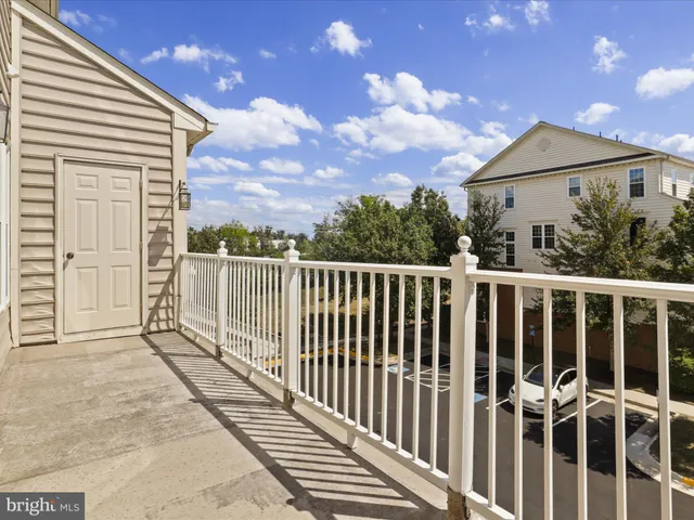 an empty room with a empty space and a ceiling fan