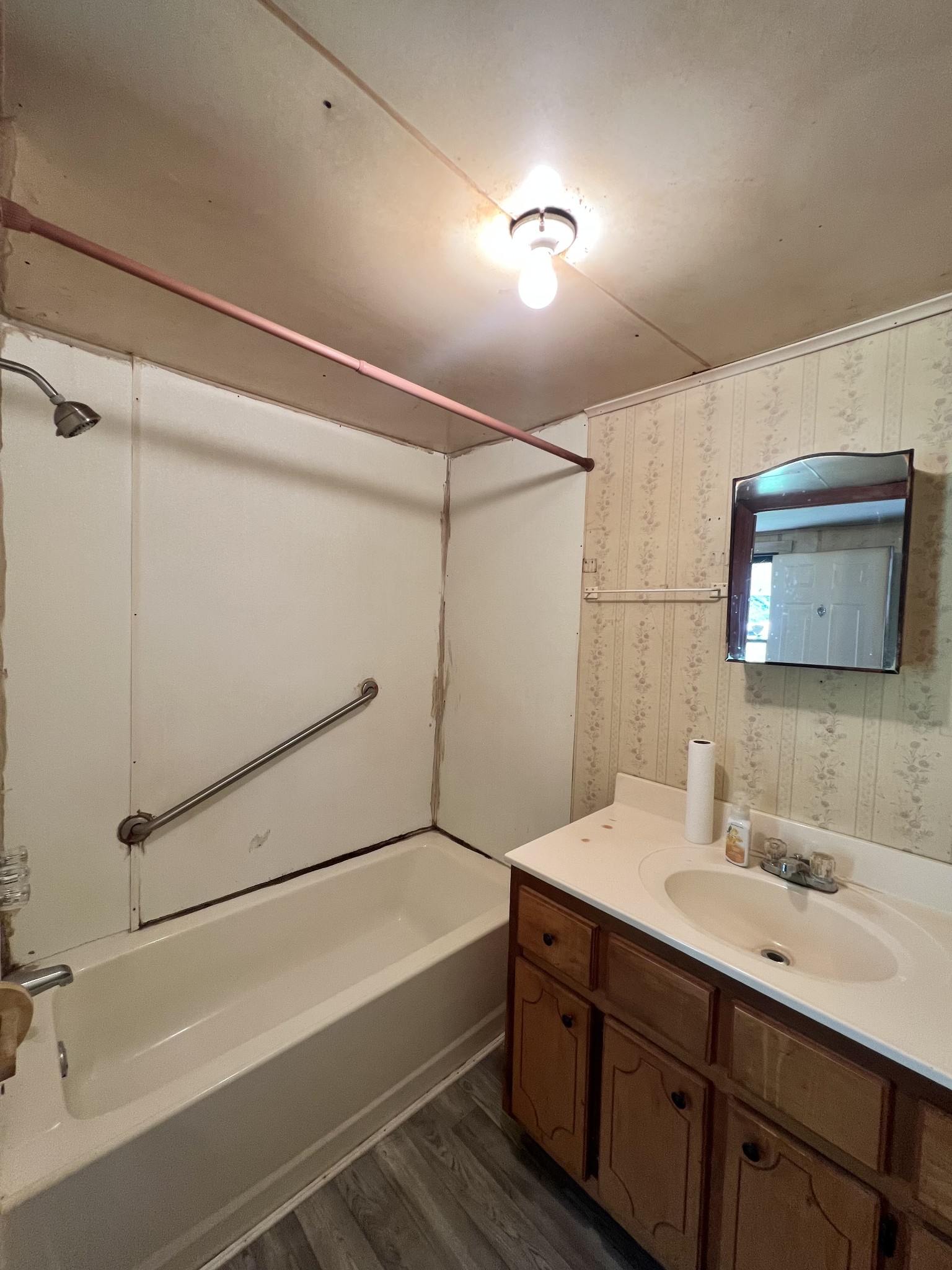 3467 Fall River Road Pulaski, TN 38478 - Photo 33 of 38 a bathroom with a sink mirror vanity and bathtub