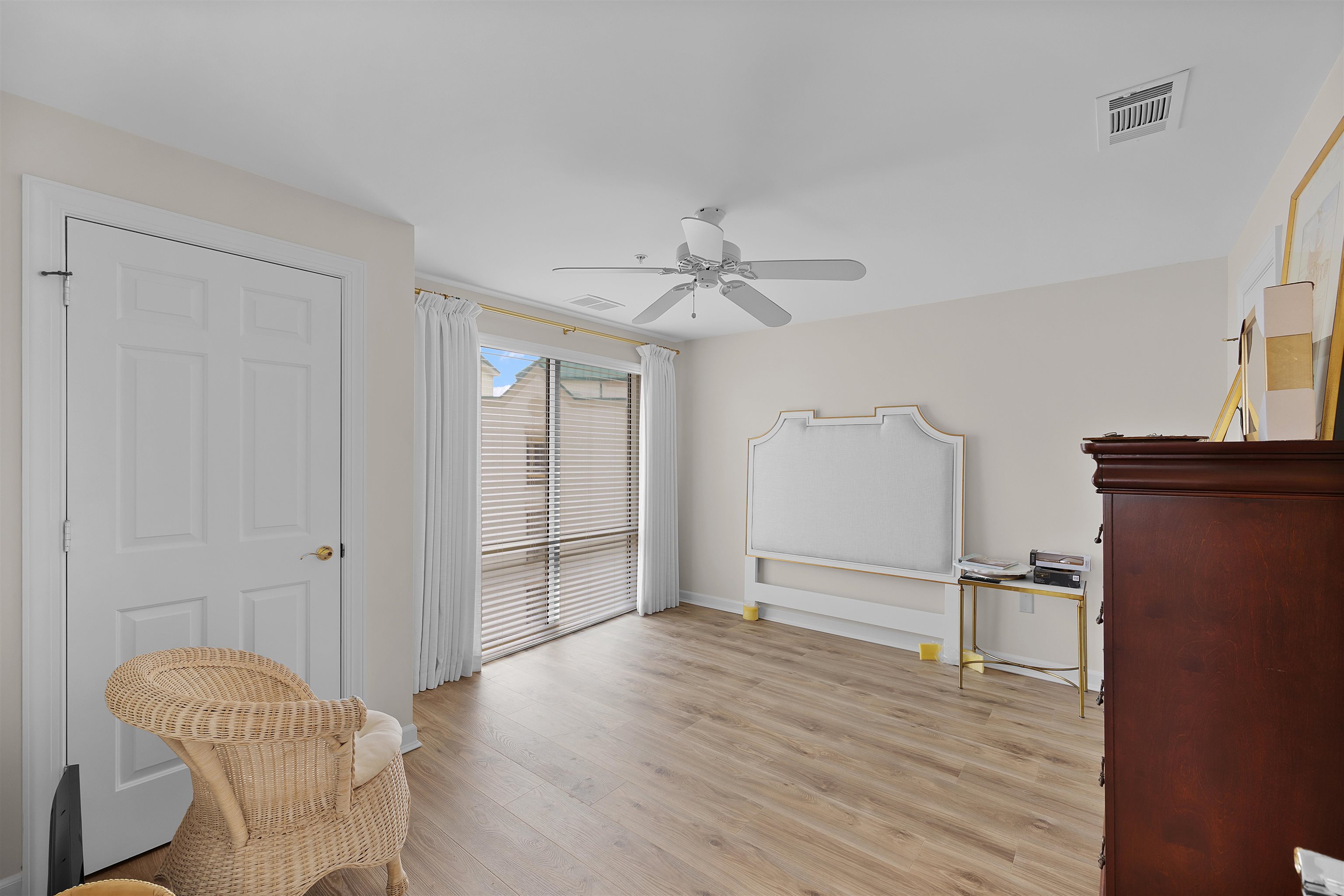 323 Cr 380 Road, Unit P 605 Iuka, MS 38852 - Photo 16 of 24 a view of empty room with wooden floor and fan