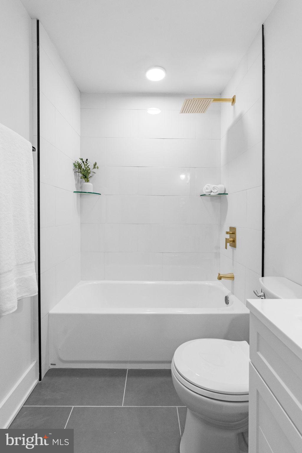 4233 Passmore Street Philadelphia, PA 19135 - Photo 16 of 30 a bathroom with a toilet and a bathtub