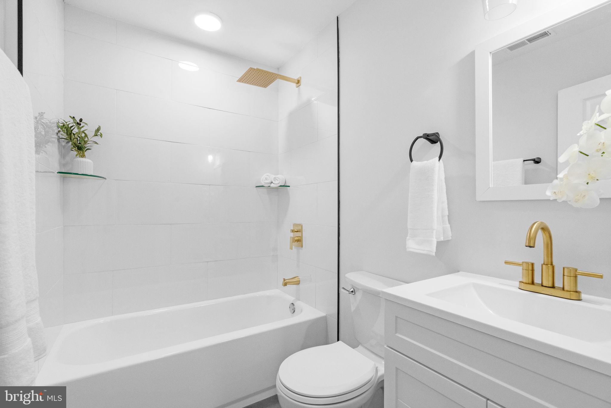 4233 Passmore Street Philadelphia, PA 19135 - Photo 17 of 30 a bathroom with a sink a toilet and a bathtub