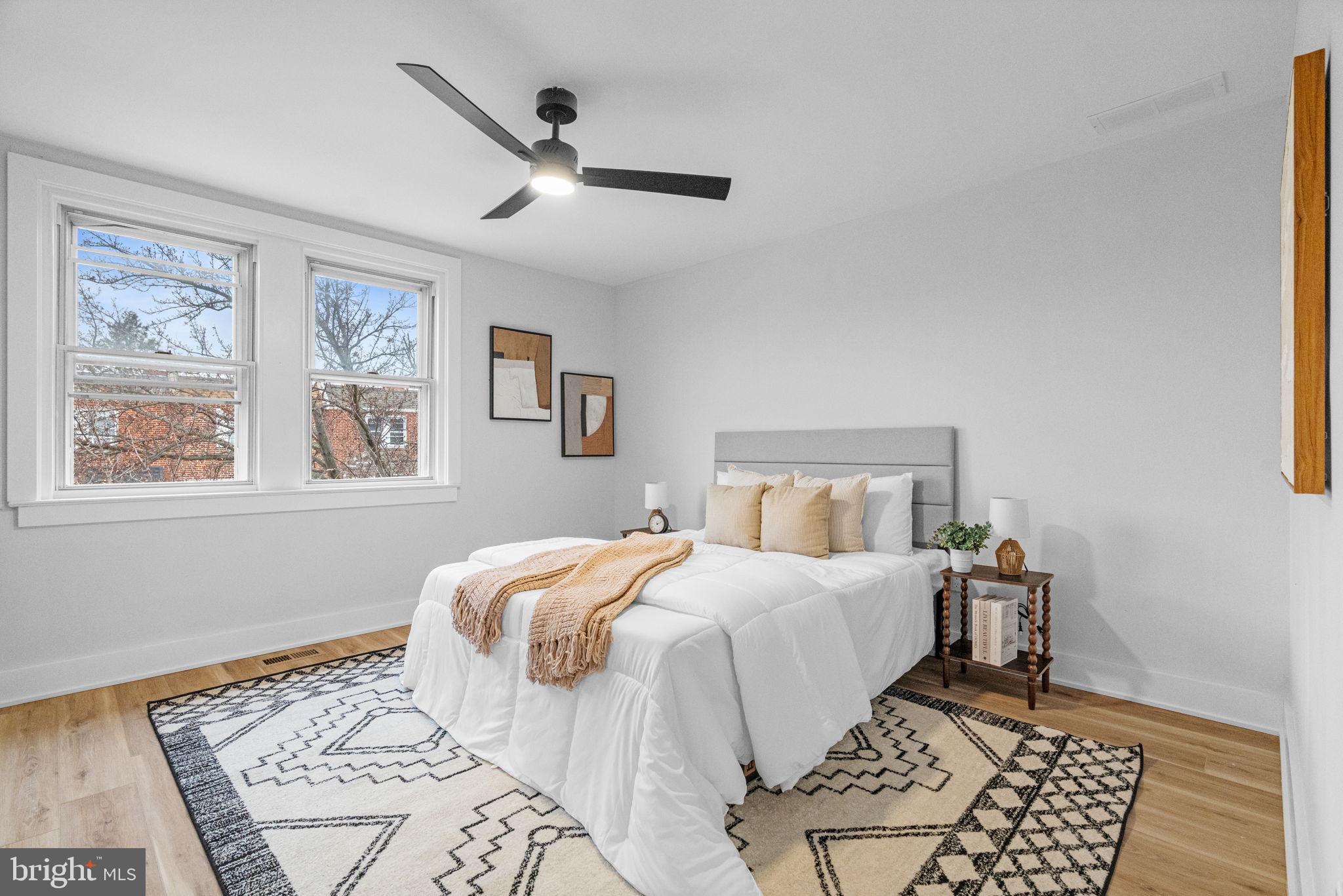 4233 Passmore Street Philadelphia, PA 19135 - Photo 18 of 30 a bedroom with a large bed and a window