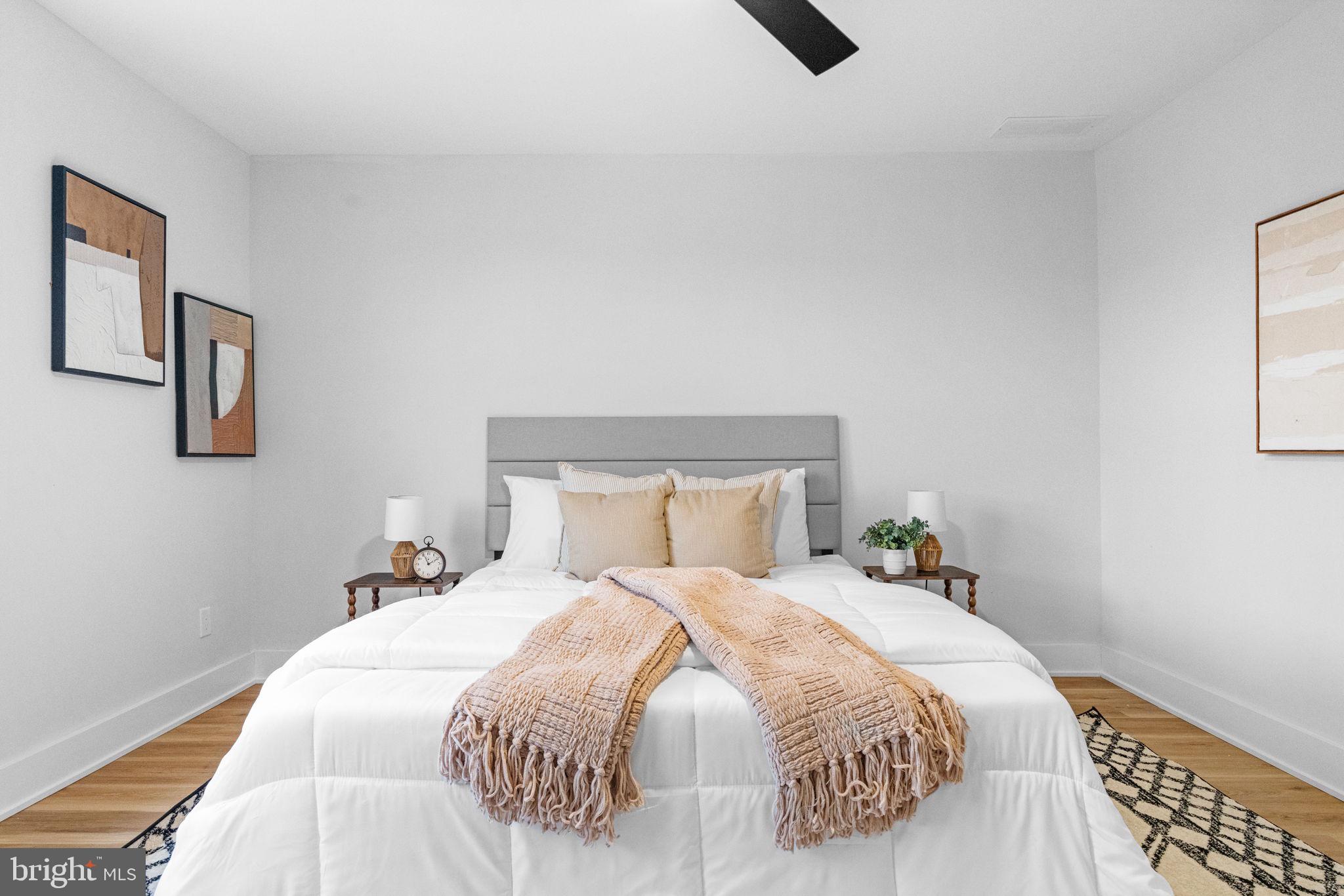 4233 Passmore Street Philadelphia, PA 19135 - Photo 19 of 30 a bedroom with a bed and painting on the wall