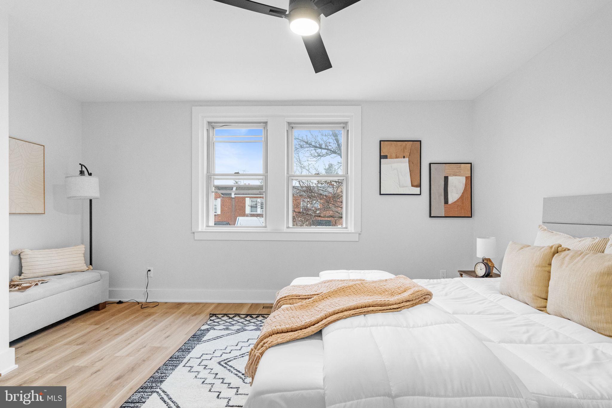 4233 Passmore Street Philadelphia, PA 19135 - Photo 20 of 30 a bedroom with a bed and painting on the wall