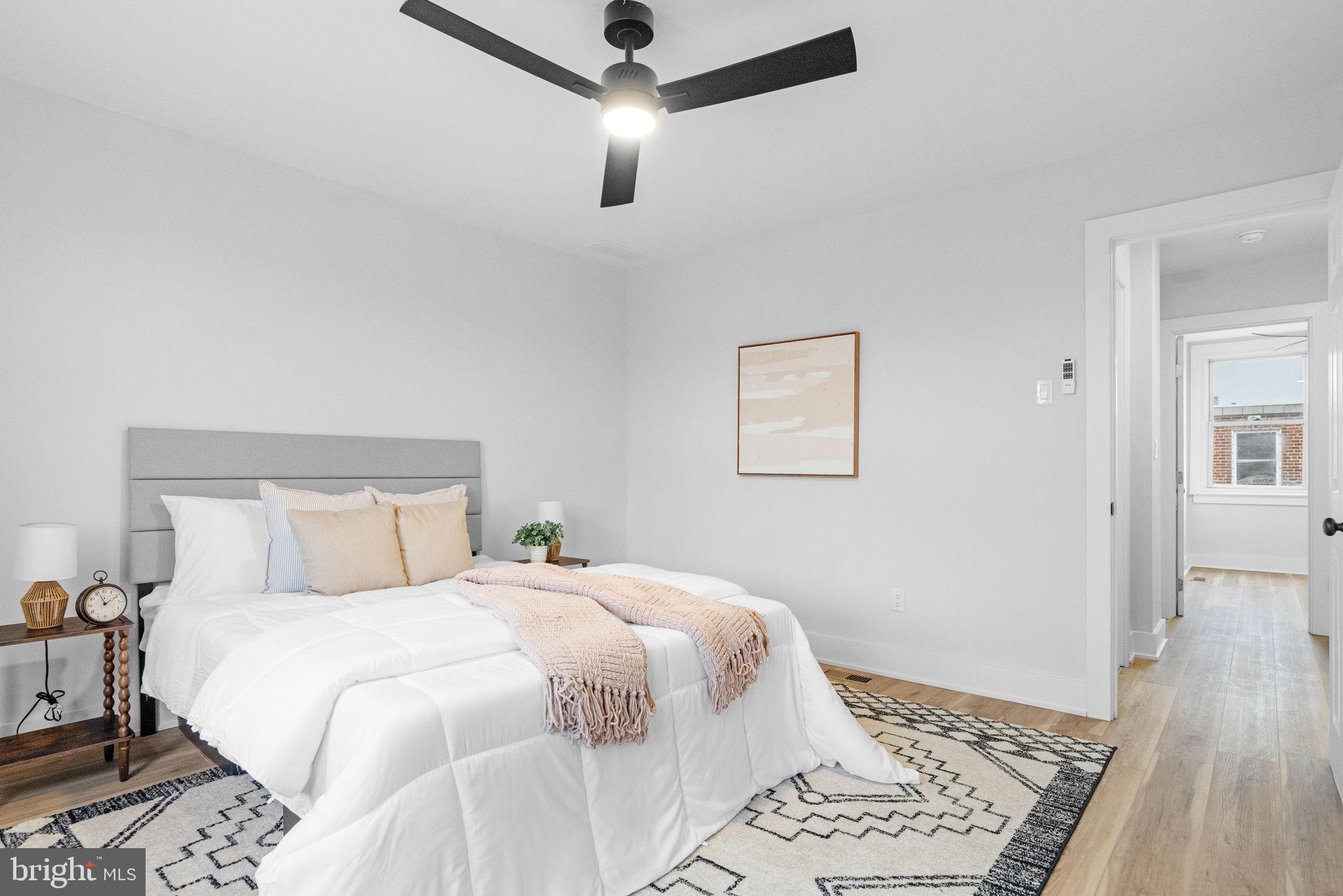 4233 Passmore Street Philadelphia, PA 19135 - Photo 21 of 30 a bedroom with a large bed and a rug