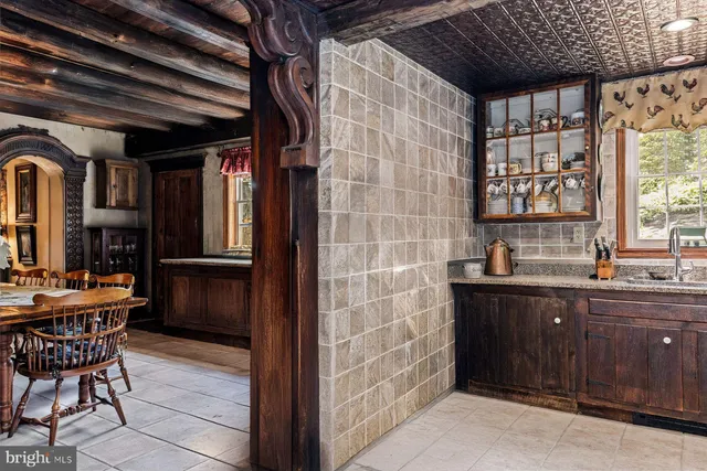 a kitchen with a sink and wooden cabinets