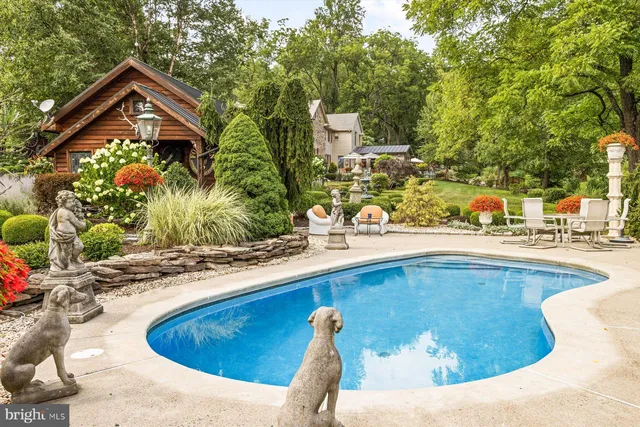 a view of a swimming pool with a lounge chairs