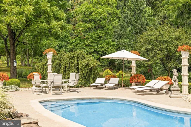 a kitchen with stainless steel appliances granite countertop a refrigerator a stove and a refrigerator