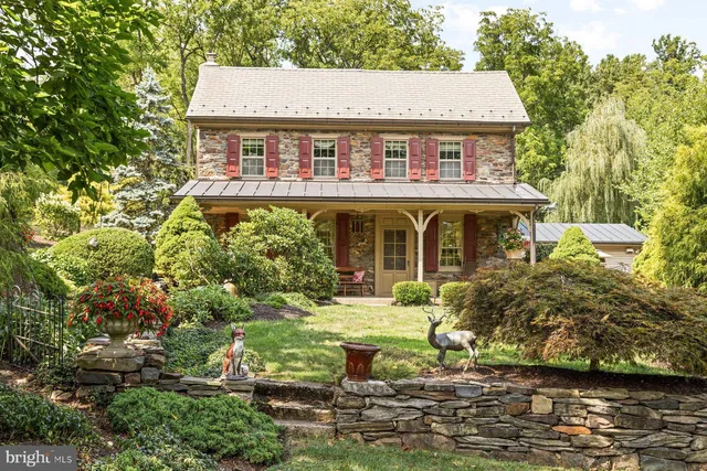 a view of a house with swimming pool next to a yard
