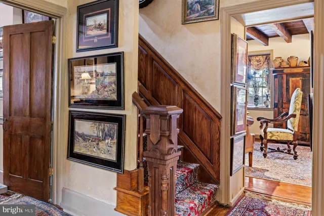 a view of an entryway with wooden floor and windows