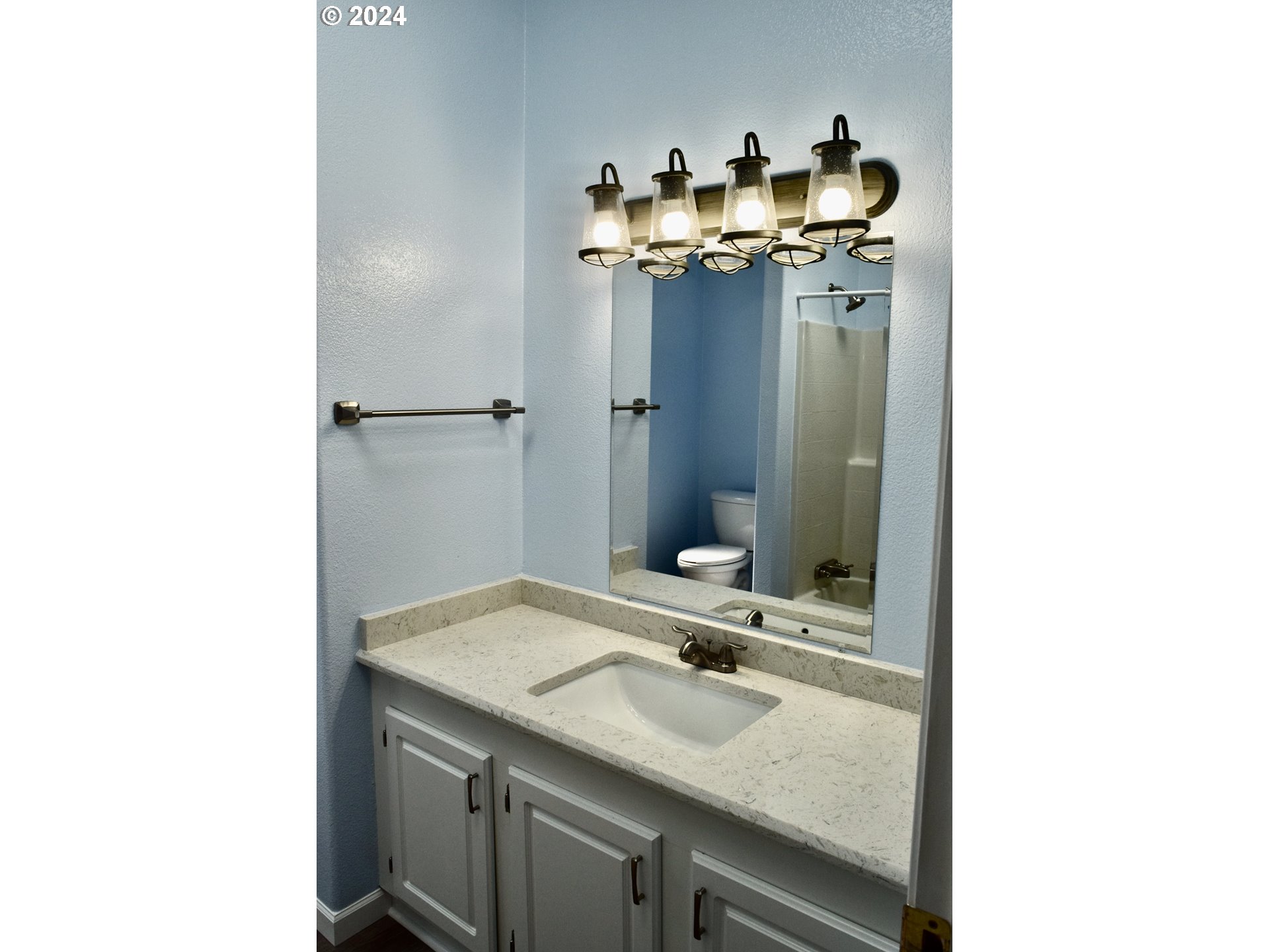 27286 Eighty Acres Road Gold Beach, OR 97444 - Photo 13 of 46 a bathroom with a sink and a mirror