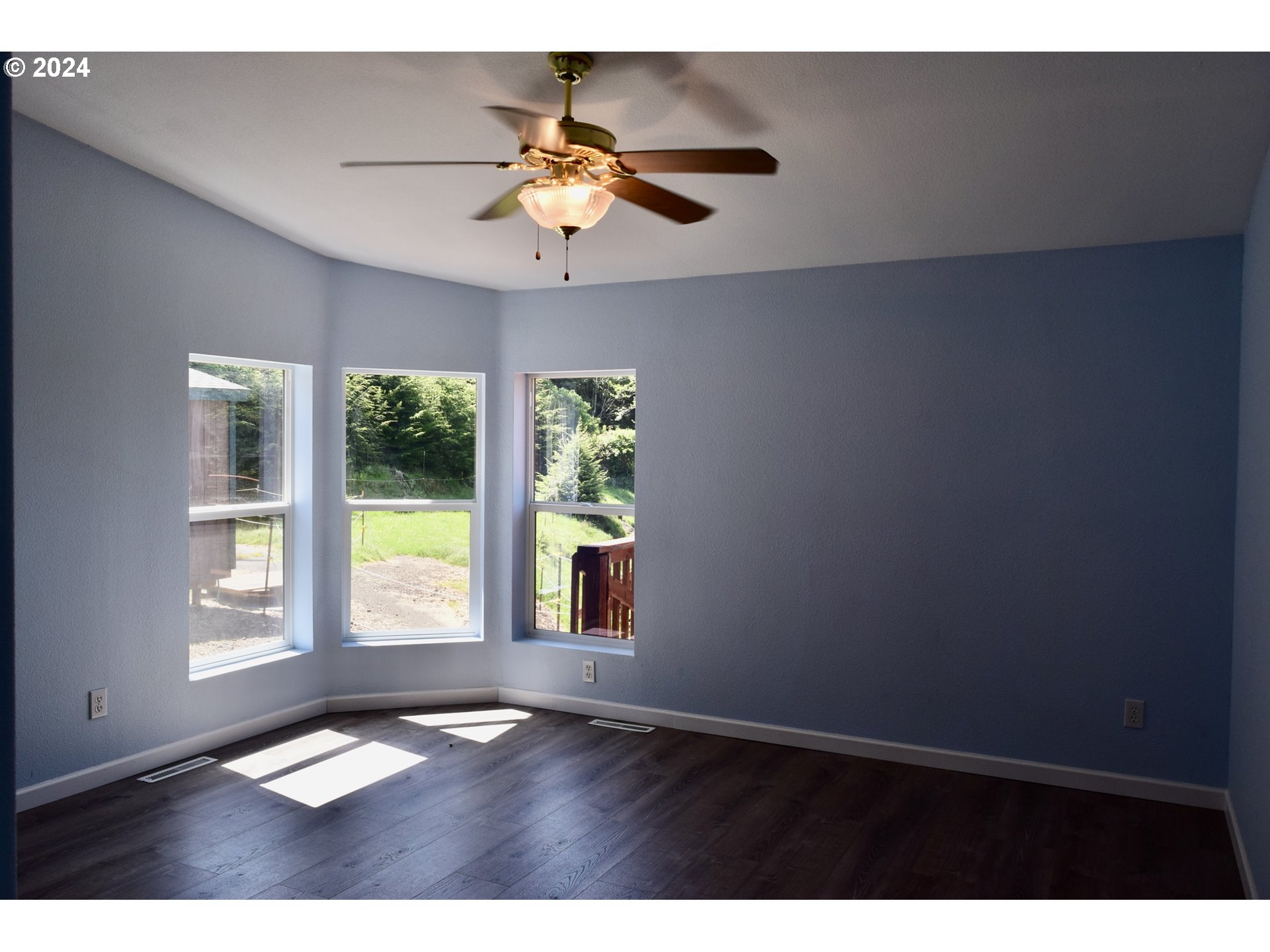 27286 Eighty Acres Road Gold Beach, OR 97444 - Photo 14 of 46 a view of an empty room with a window