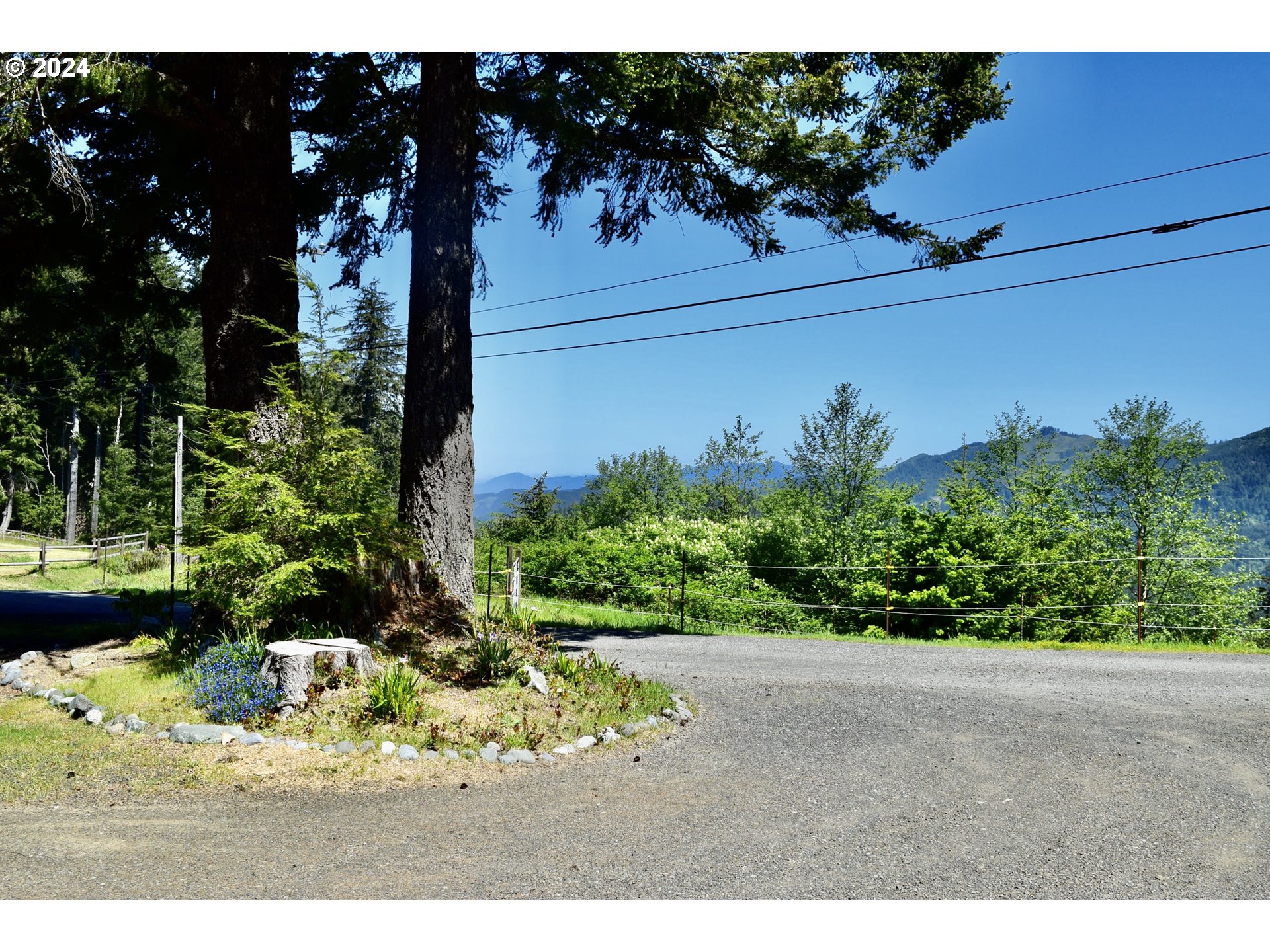 27286 Eighty Acres Road Gold Beach, OR 97444 - Photo 24 of 46 a view of a garden