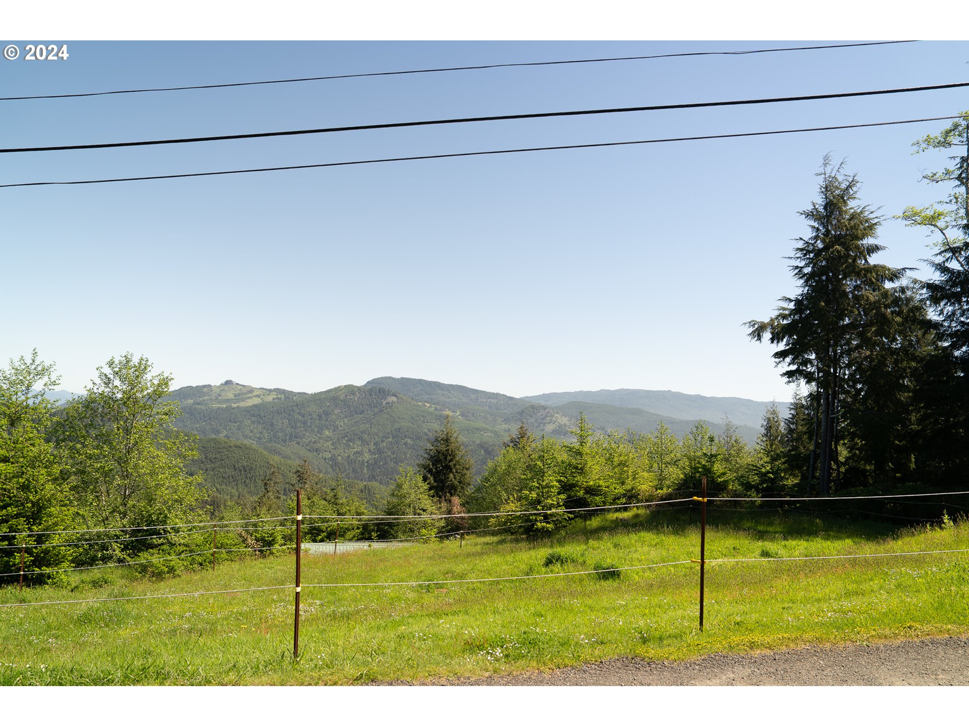 27286 Eighty Acres Road Gold Beach, OR 97444 - Photo 29 of 46 a view of a field with an ocean