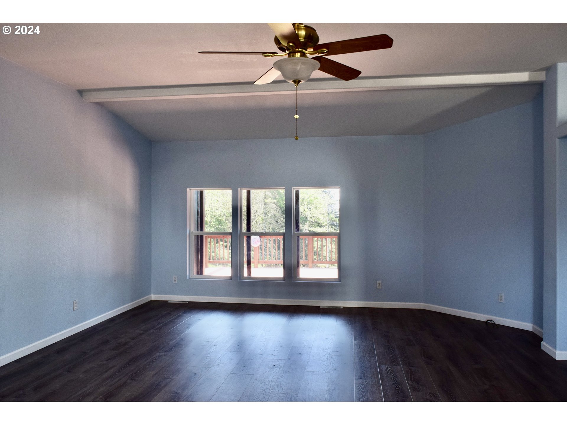 27286 Eighty Acres Road Gold Beach, OR 97444 - Photo 3 of 46 a view of an empty room with wooden floor and a window