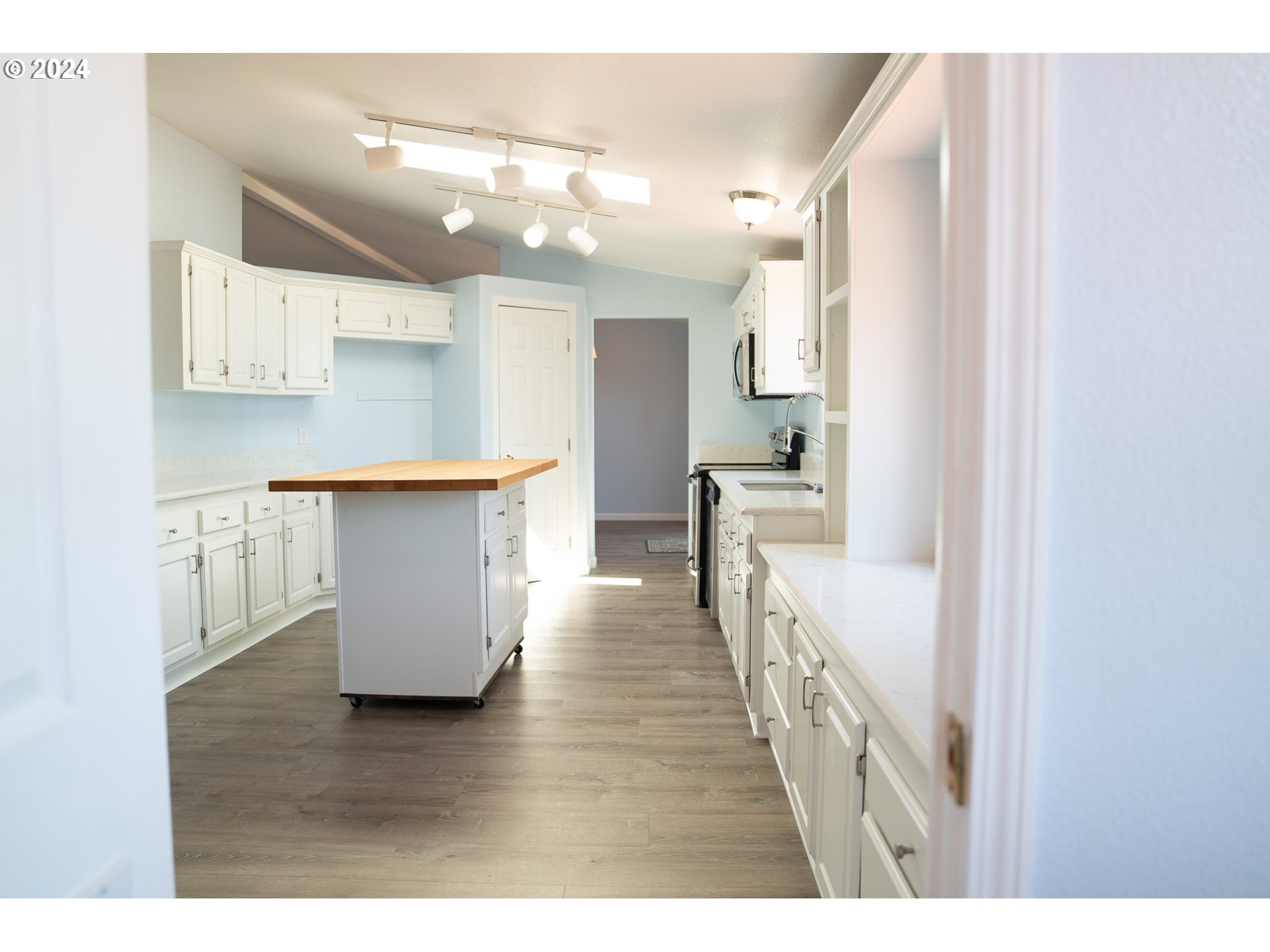27286 Eighty Acres Road Gold Beach, OR 97444 - Photo 32 of 46 a view of kitchen with windows and cabinets