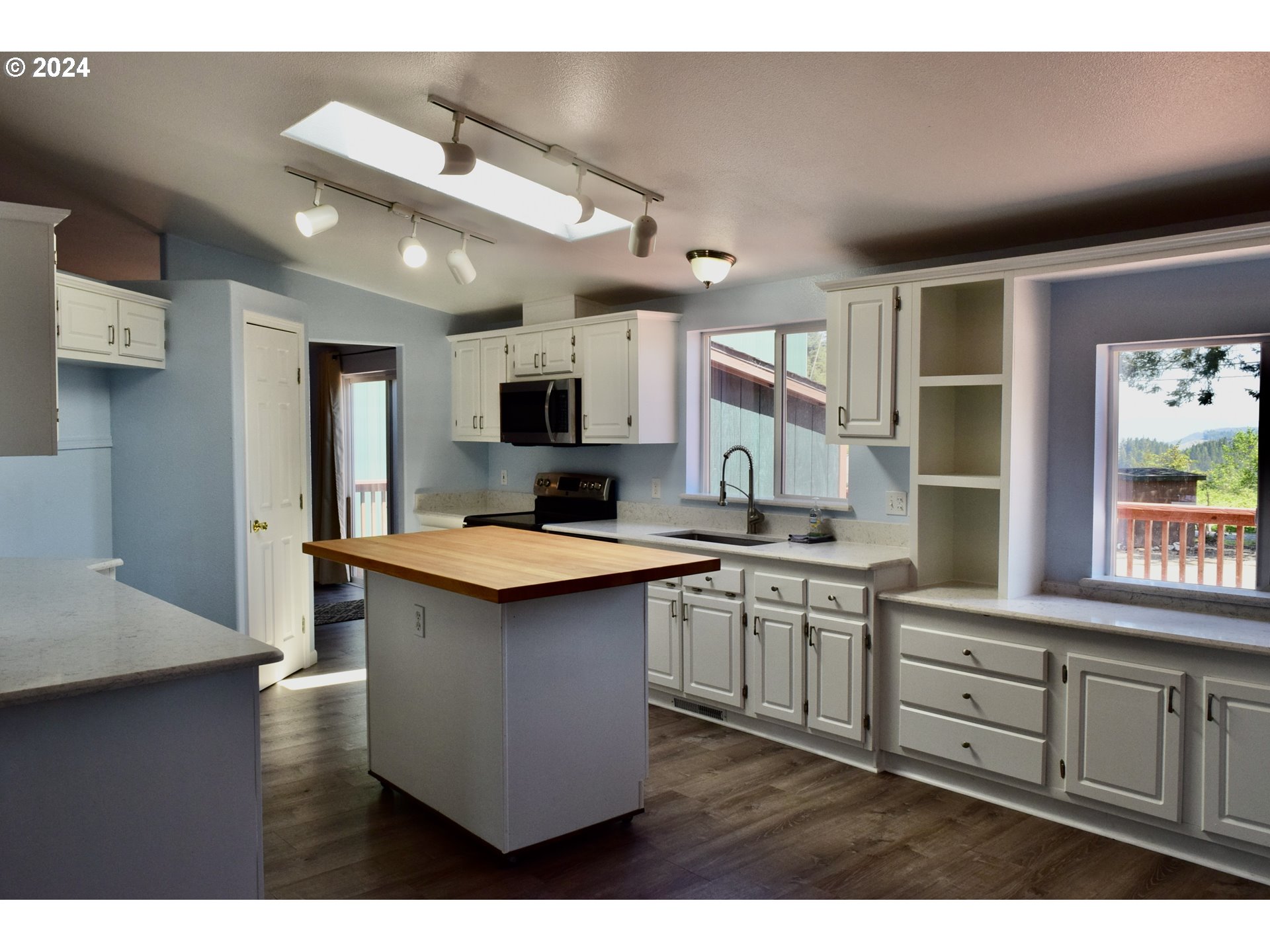 27286 Eighty Acres Road Gold Beach, OR 97444 - Photo 4 of 46 a kitchen with counter top space sink and center island