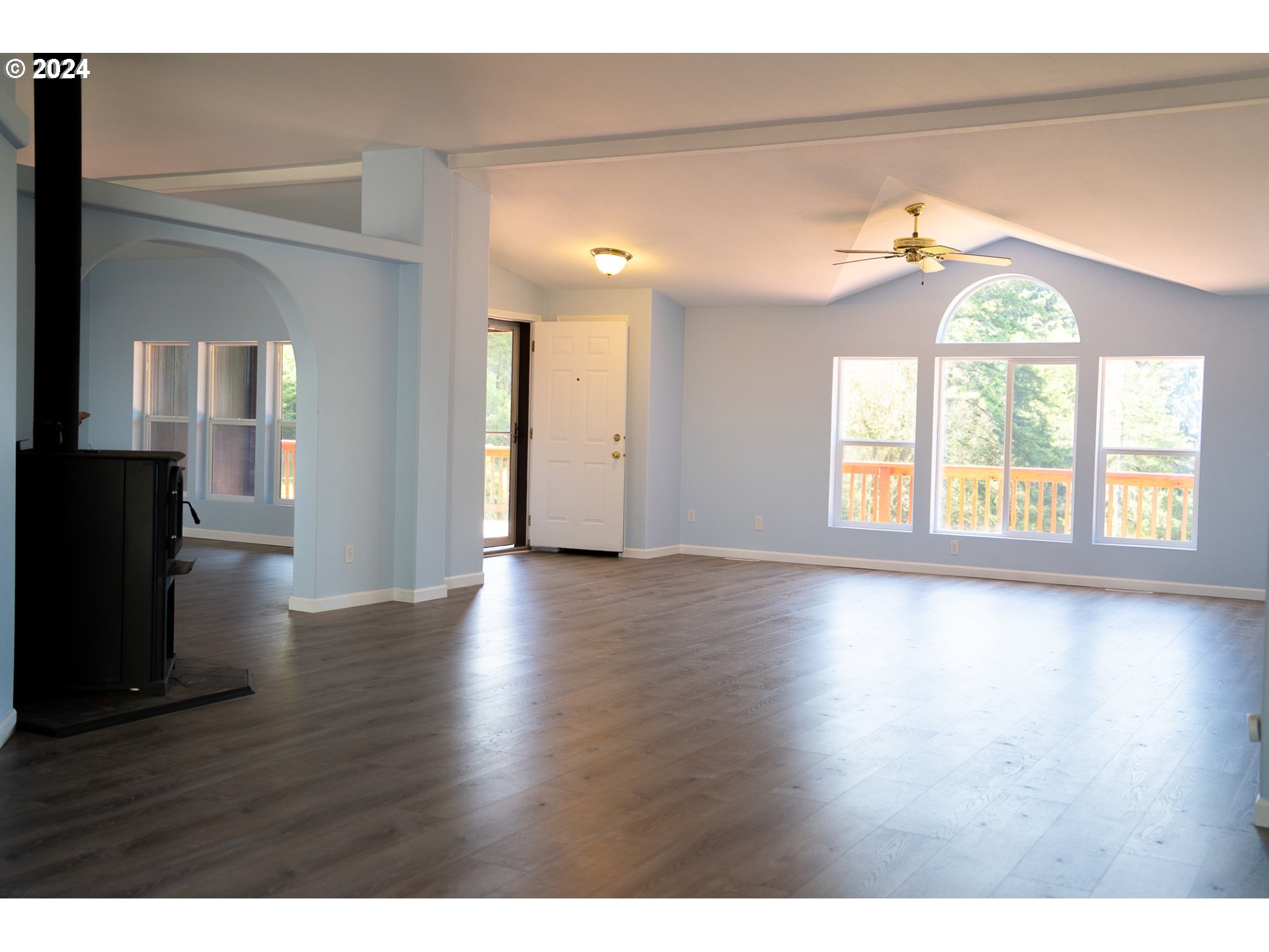 27286 Eighty Acres Road Gold Beach, OR 97444 - Photo 41 of 46 a view of an empty room with wooden floor and a window