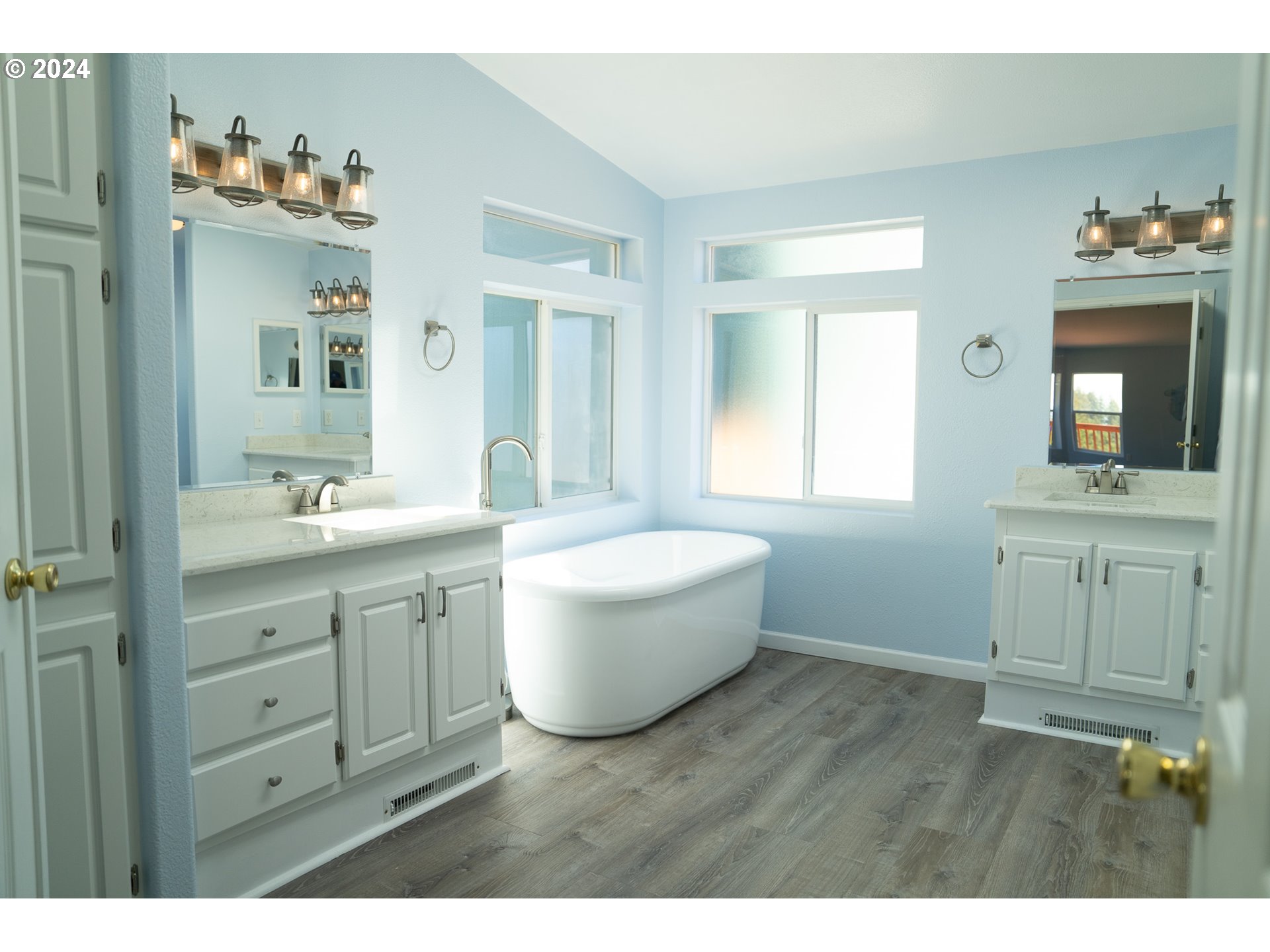 27286 Eighty Acres Road Gold Beach, OR 97444 - Photo 42 of 46 a bathroom with a granite countertop sink mirror and bathtub