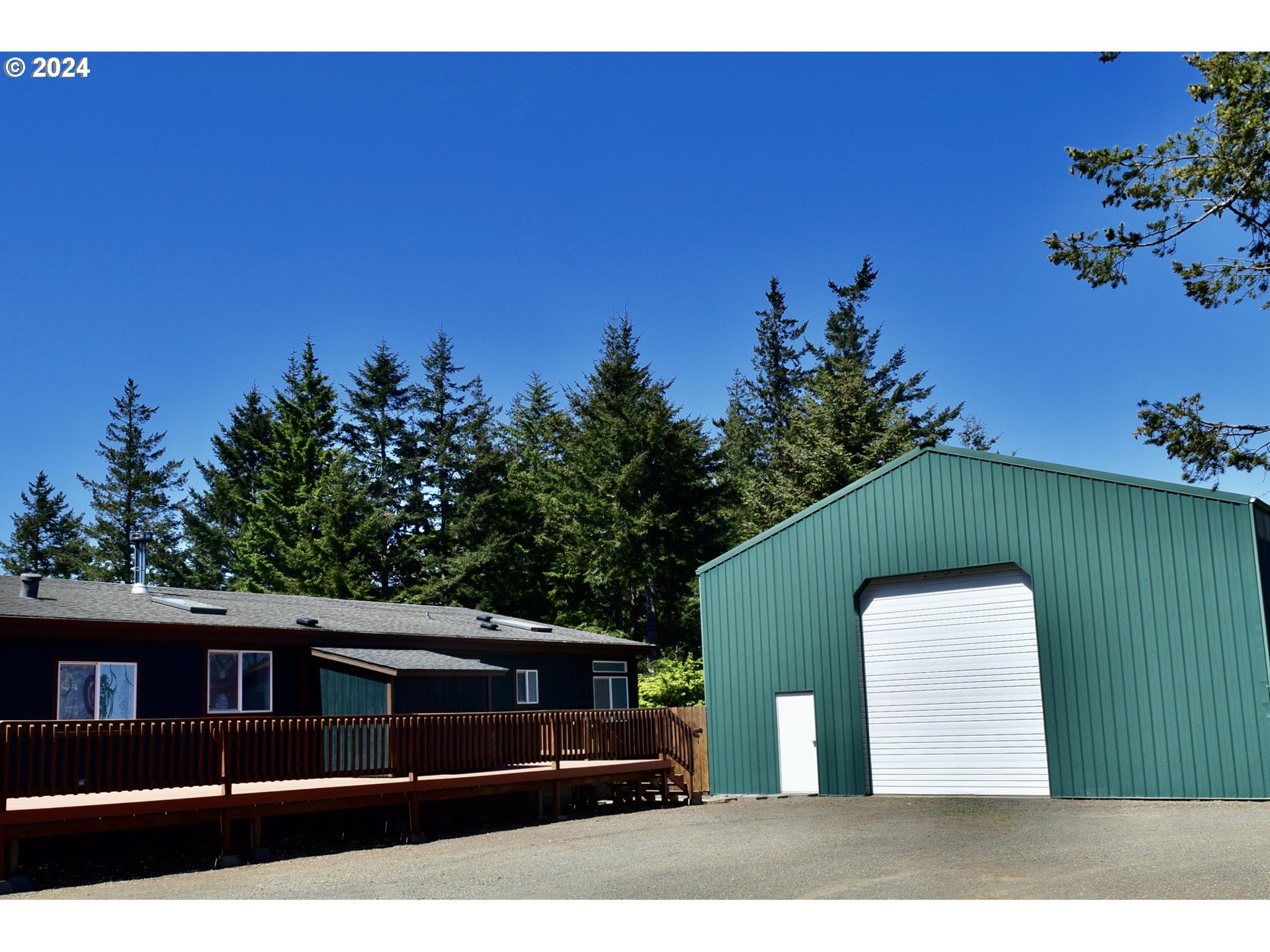 27286 Eighty Acres Road Gold Beach, OR 97444 - Photo 7 of 46 a view of house with a yard