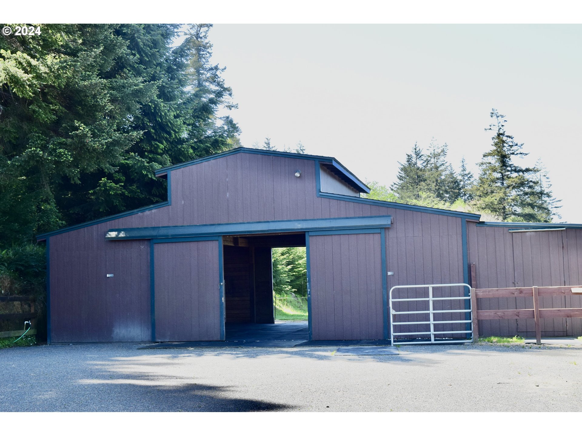 27286 Eighty Acres Road Gold Beach, OR 97444 - Photo 9 of 46 a house view with a outdoor space