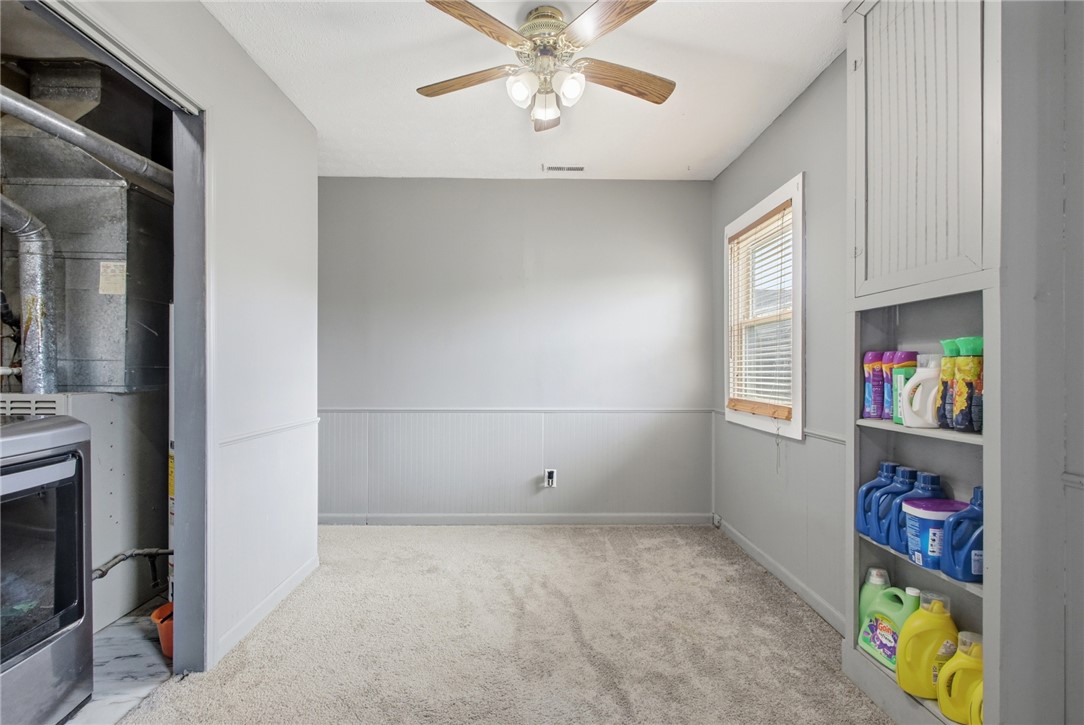2745 Share Street Springfield, OH 45505 - Photo 15 of 28 This spacious laundry area offers practical built-in shelving and convenient features for everyday tasks.