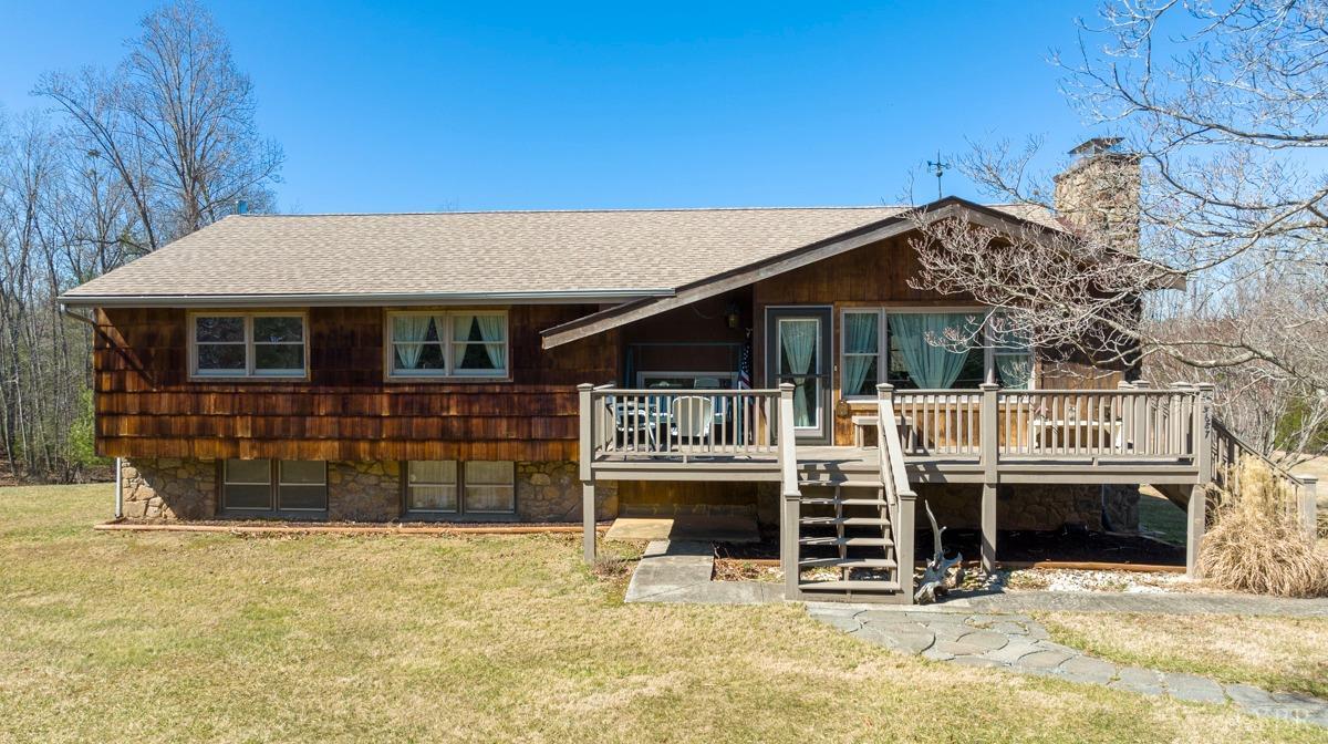 5687 Elon Road Monroe, VA 24574 - Photo 1 of 60 a front view of a house with a yard outdoor seating and garage