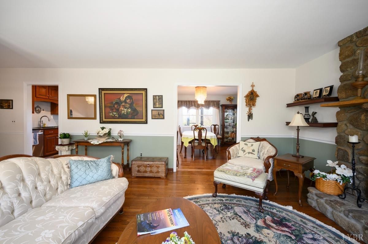 5687 Elon Road Monroe, VA 24574 - Photo 39 of 60 a living room with furniture and wooden floor